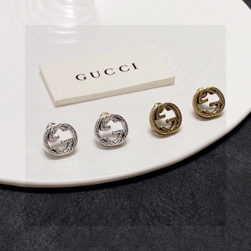 G*u*i earrings